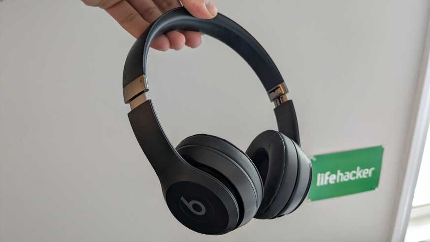 Me holding the Beats Solo 4 headphones.